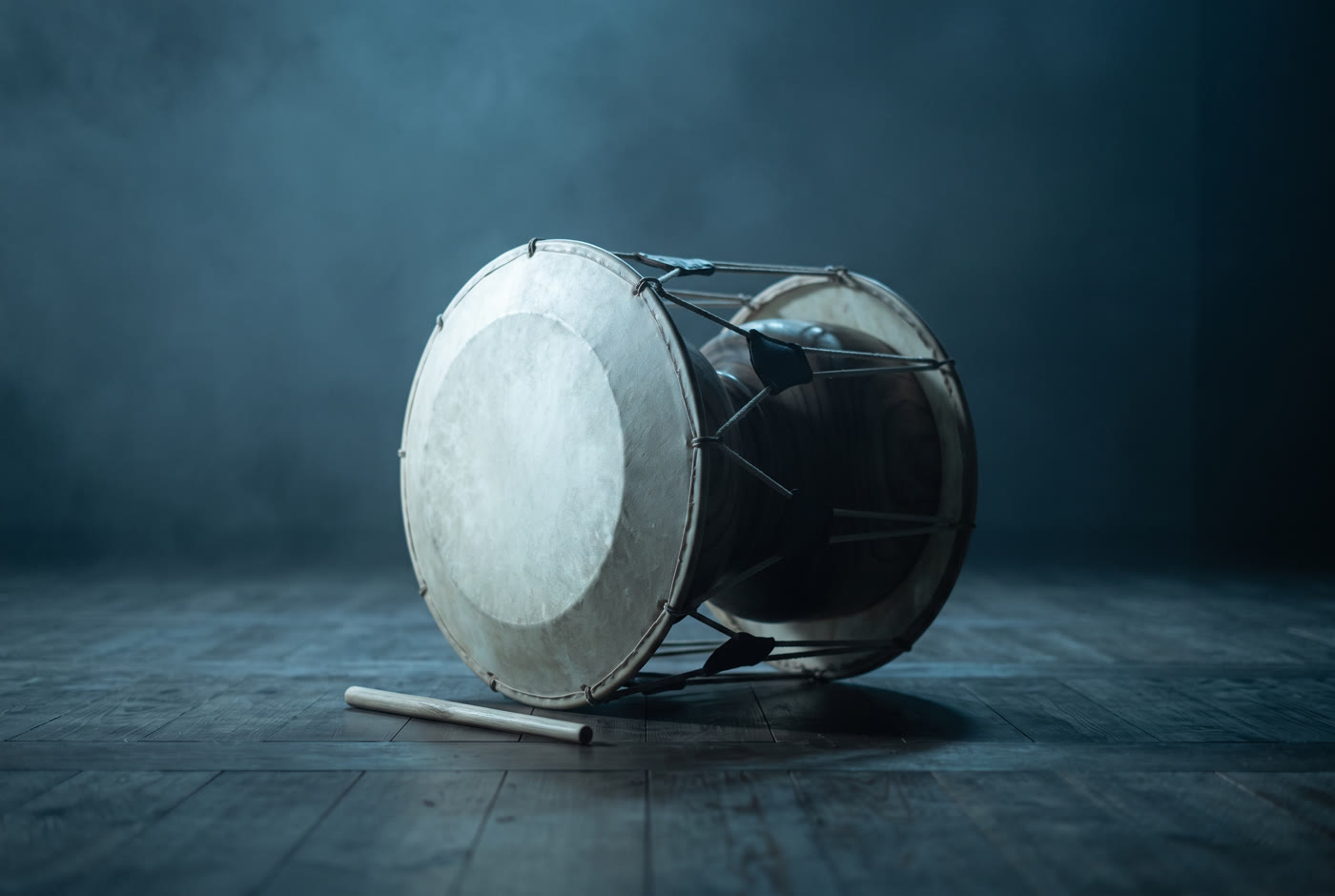 A sori drum alone on a dark stage